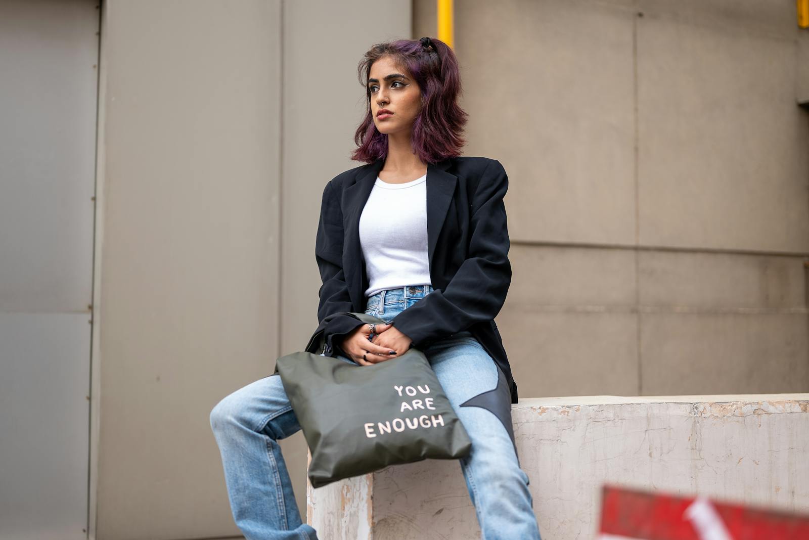 A Woman with a Tote Bag on a Street